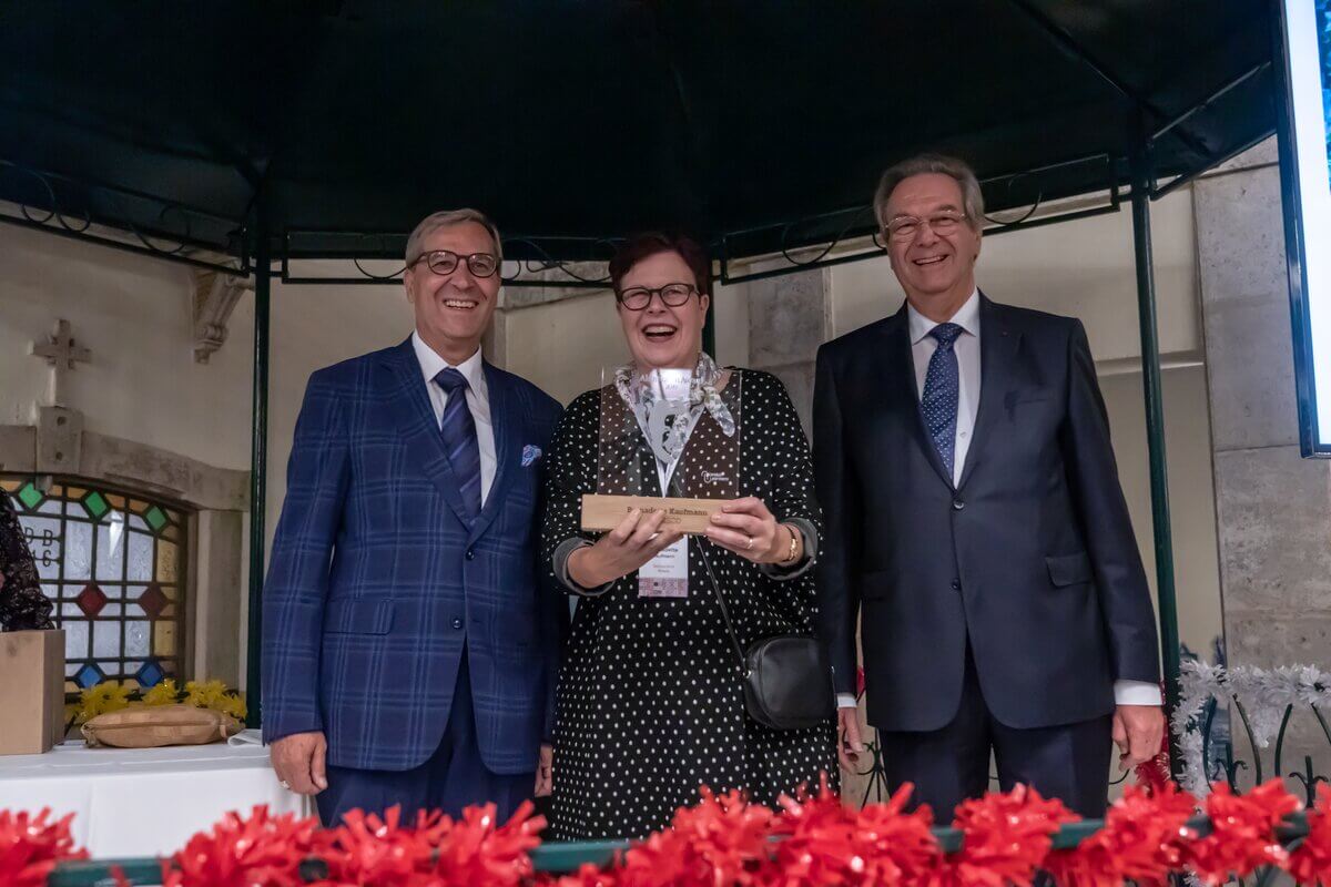 three people at a prize giving